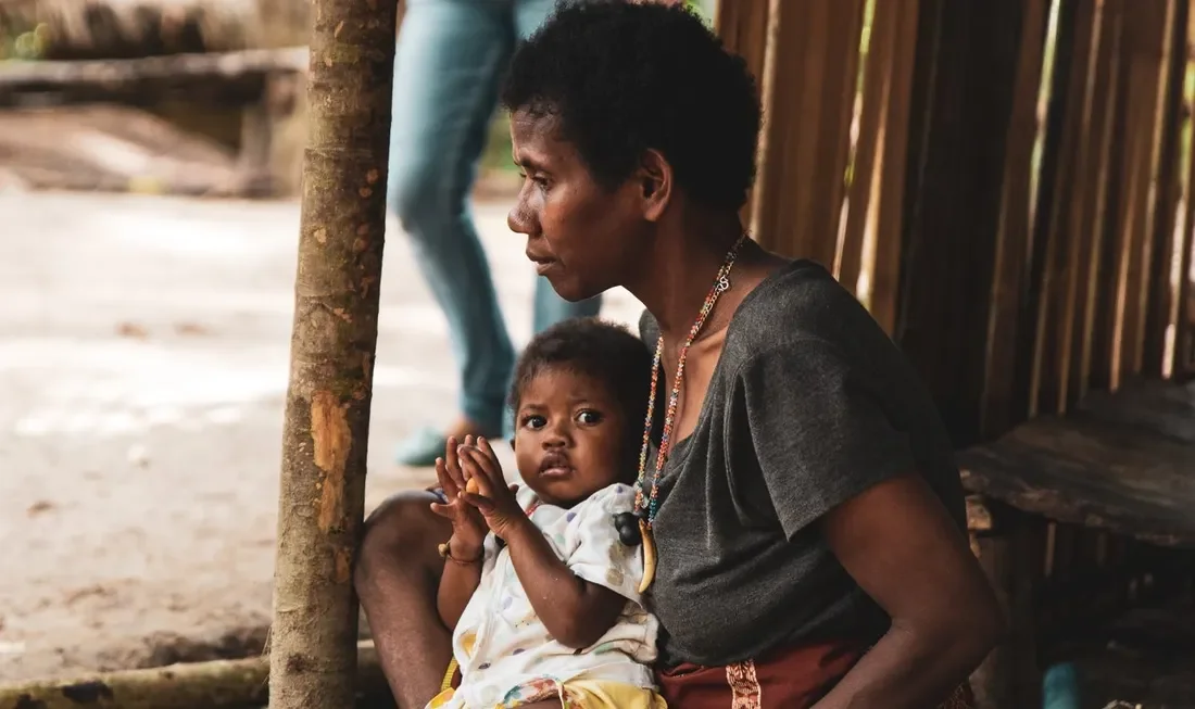 Portait of An, a Maniq tribe leader and her daughter — Image via TravelFeed by worldcapture
