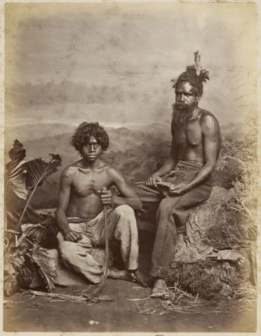 Staged photo of two men, wearing European clothe