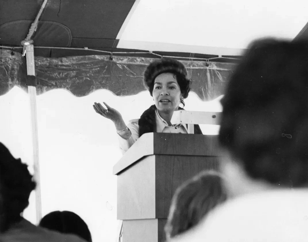 Bacon-Bercey speaking at an AAAU Women's luncheon. Courtesy Dail St. Claire. https://www.smithsonianmag.com/smart-news/remembering-june-bacon-bercey-pioneering-african-american-meteorologist-180973933/