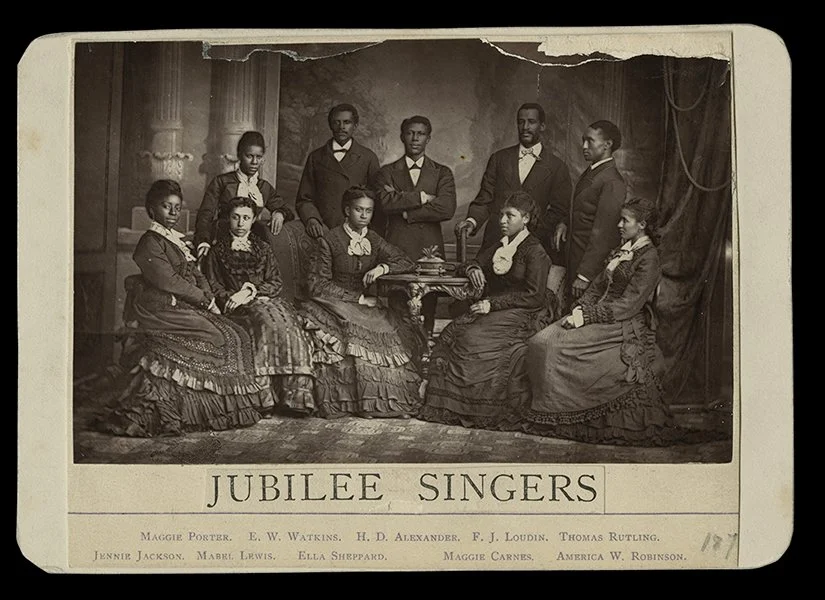 Albumen cabinet card of the Fisk Jubilee Singers in London. This photograph was commissioned by Queen Victoria who arranged for it to be sent to America as 'a gift from England to Fisk'. Circa 1876.