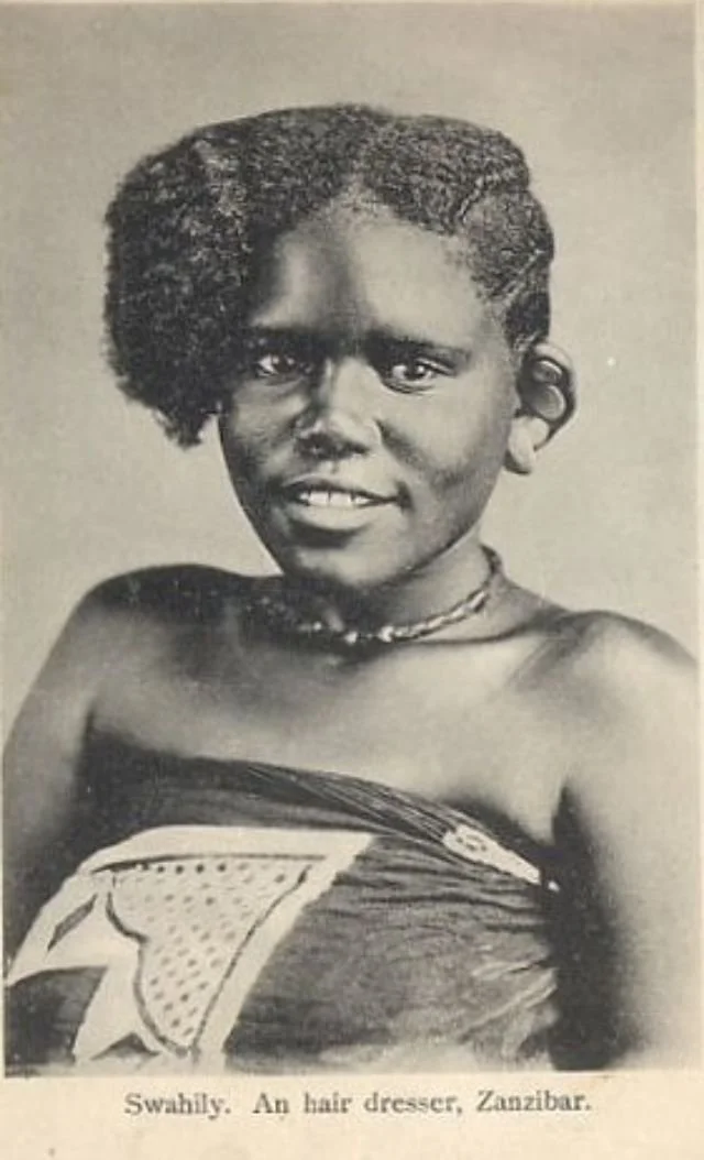 Half afro, half braided hairstyle worn by a Swahili girl. Sourced from Vintag.es.