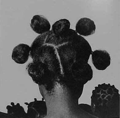 "Mkpuk Eba", photographed by J.D. 'Okhai Ojeikere, 1974. Showcasing bantu knots, which started in the Zulu Kingdom. Sourced from Kwekudee.