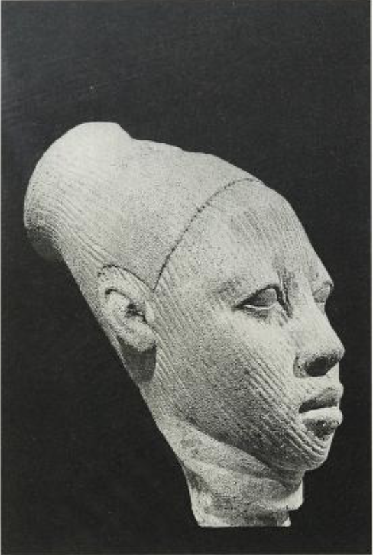 Terracotta head of man wearing a cap with a flat top. the head was clearly part of a figure as indicated by the lug at the base of the neck which would have fitted into a solid torso. made between 12th century and the 15th century A.D. p.50 from Two 