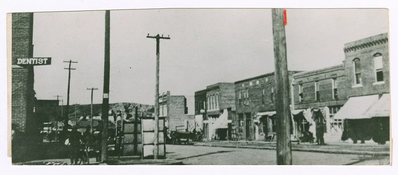 Photographic print of the Greenwood district in Tulsa, Oklahoma, before 1921. (n.d.). Collection of the Smithsonian National Museum of African American History and Culture, Gift of the Families of Anita Williams Christopher and David Owen Williams. 