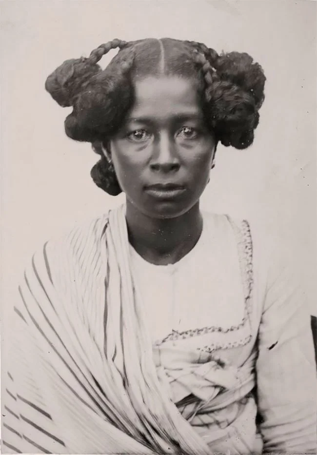 Madagascan women, showcasing their hairstyles, early 20th century. 