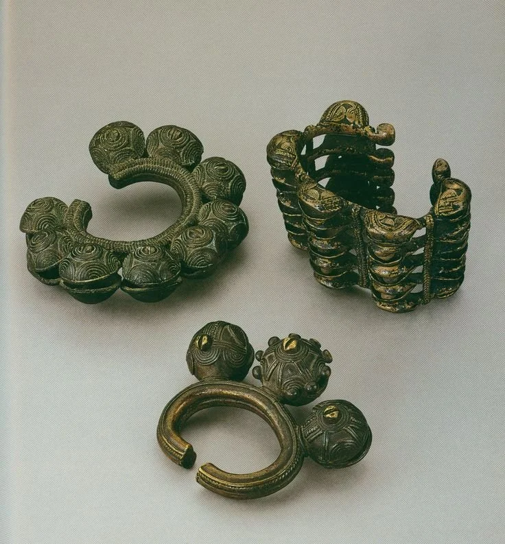 Wobe ankle bells from the Ivory Coast which  functioned as both currency and ceremonial dance adornments, with the hollow pellets serving as rattles.