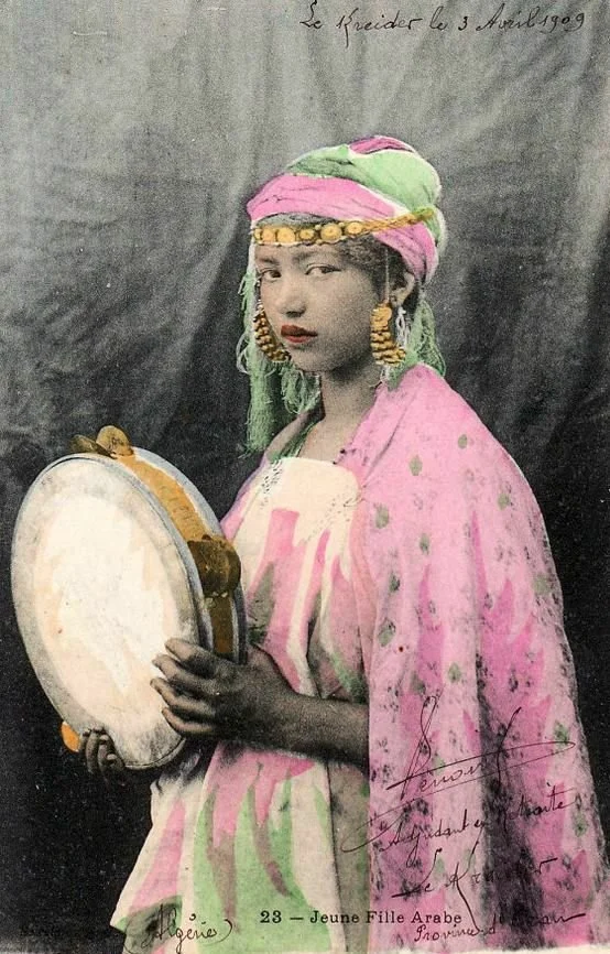 North African woman with tambourine. 