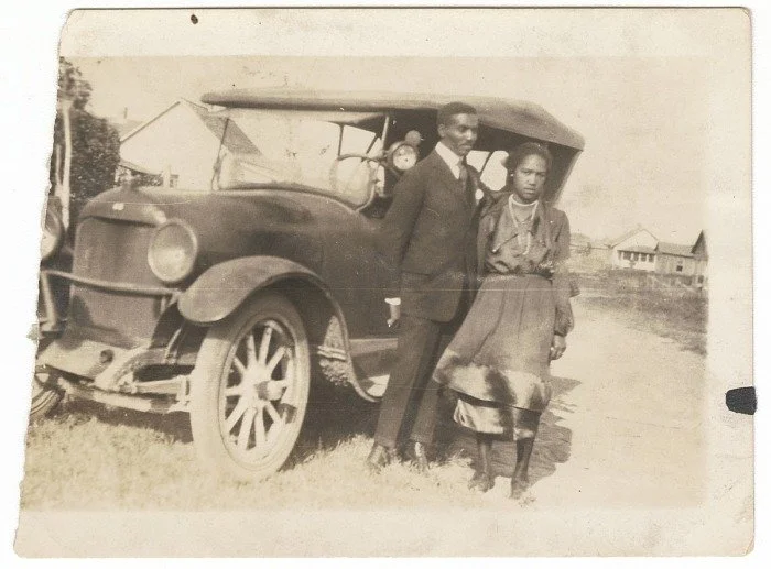The Princetta R. Newman Collection of Family Photographs, Tulsa, Oklahoma. (n.d.-a). Photographic print of a man and woman standing in front of a car, 1920’s. Collection of the Smithsonian National Museum of African American History and Culture, Gift
