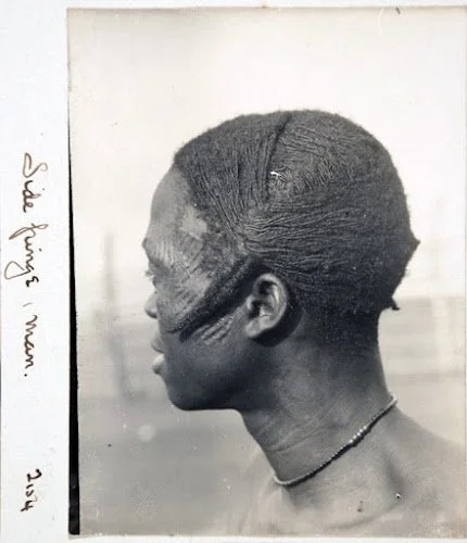 North Thomas' notes on an Igbo man from Agulu: "Side fringe[?], man. 1910-11. " This style appears on a number of Igbo men and may have some significance.

Northcote Thomas' album, MAA Cambridge.