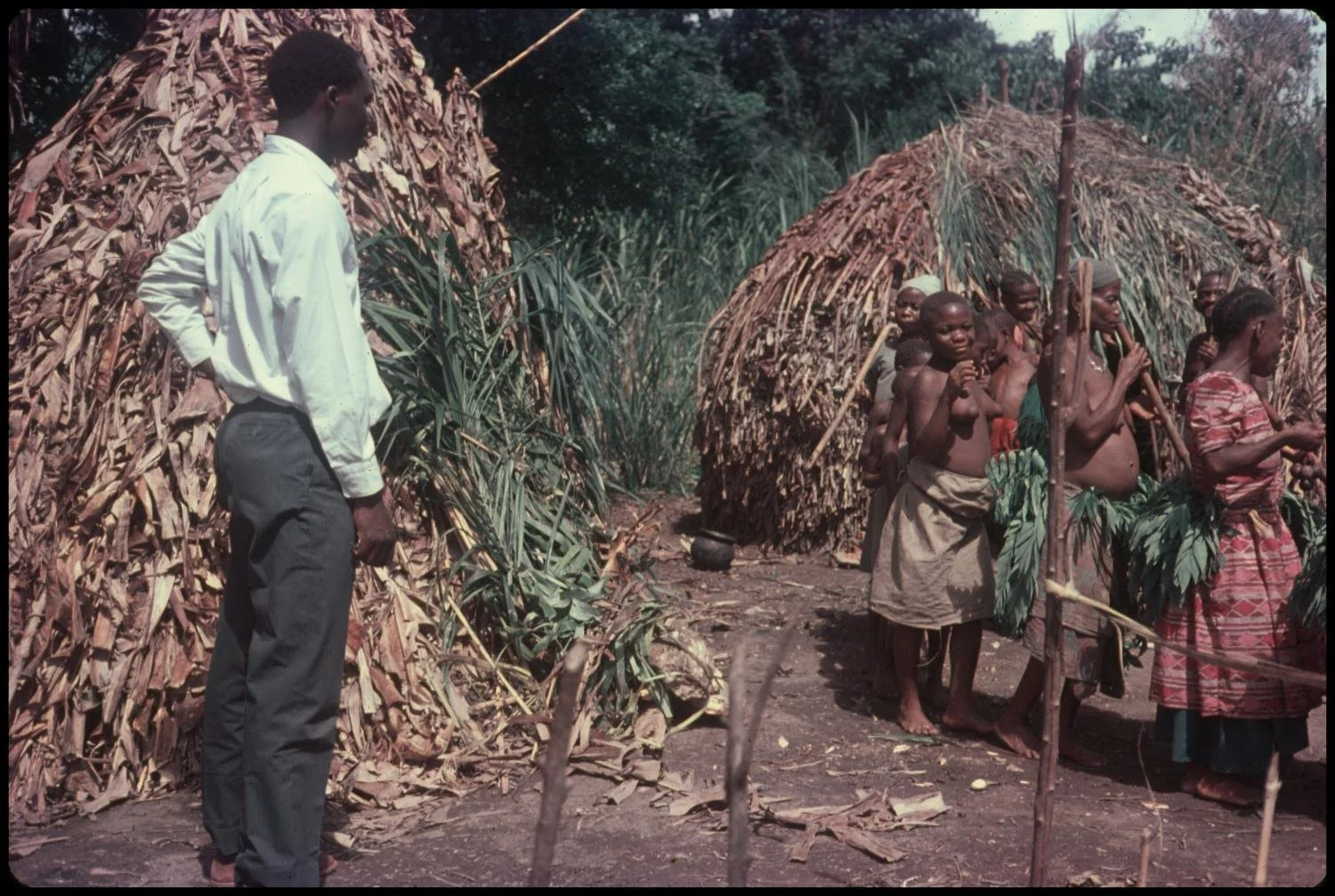 Photograph of Pygmy people dancing in the Ituri Forest in the Democratic Republic of the Congo. Zichner, Mildred Schaeffer 1968. https://texashistory.unt.edu/ark:/67531/metadc847253/