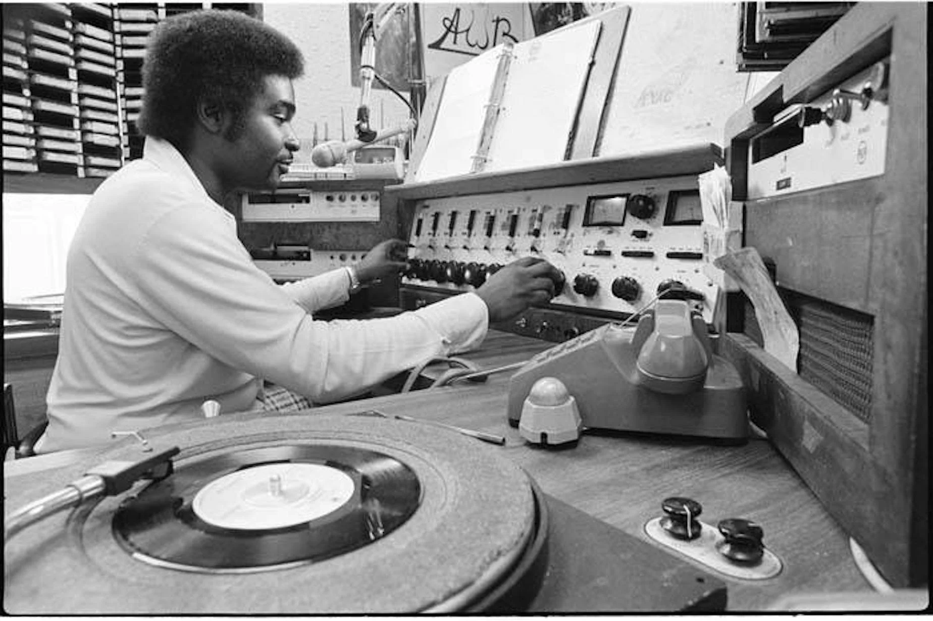 DJ Robert L. Scott in booth at Black-owned KYAC radio station, Seattle, May 1975.
Courtesy of Seattle’s Museum of History & Industry (MOHAI), Cary W. Tolman Collection. via https://www.kuow.org/stories/remembering-kyac-the-seattle-black-owned-radio-s