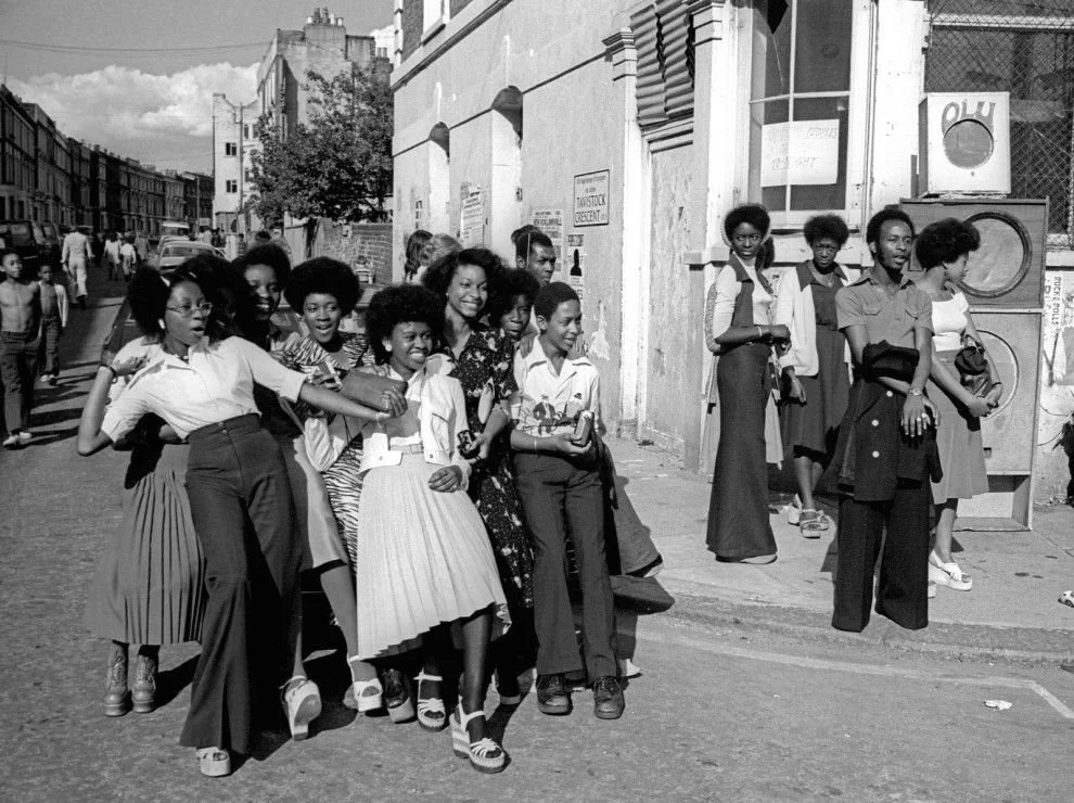 A group of Black teenagers in mid-laughter, Notting Hill, London, England, circa late 1960s–1970s.
