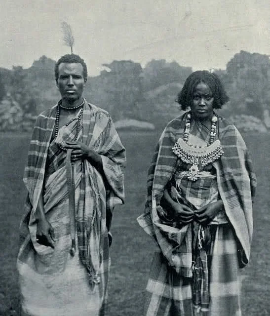Traditional Somali attire featuring handwoven Guntiino wraps and a silver dowry necklace (Muze).