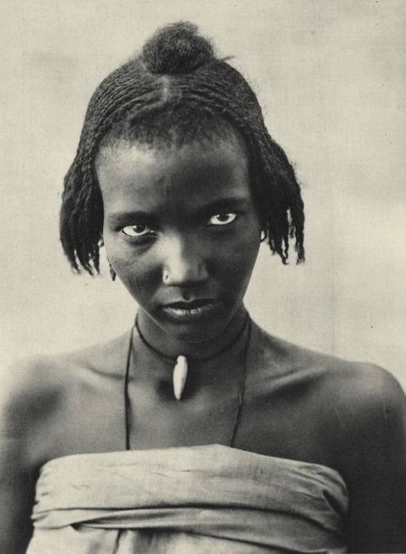 Bernatzik, H. A. (1931). Kanembu girl, Lake Tchad [Photograph], p. 20. In The dark continent: Africa, the landscape and the people. Studio London.
