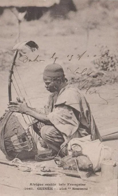 A Soussou griot from Guinea playing a musical instrument called a bolon.