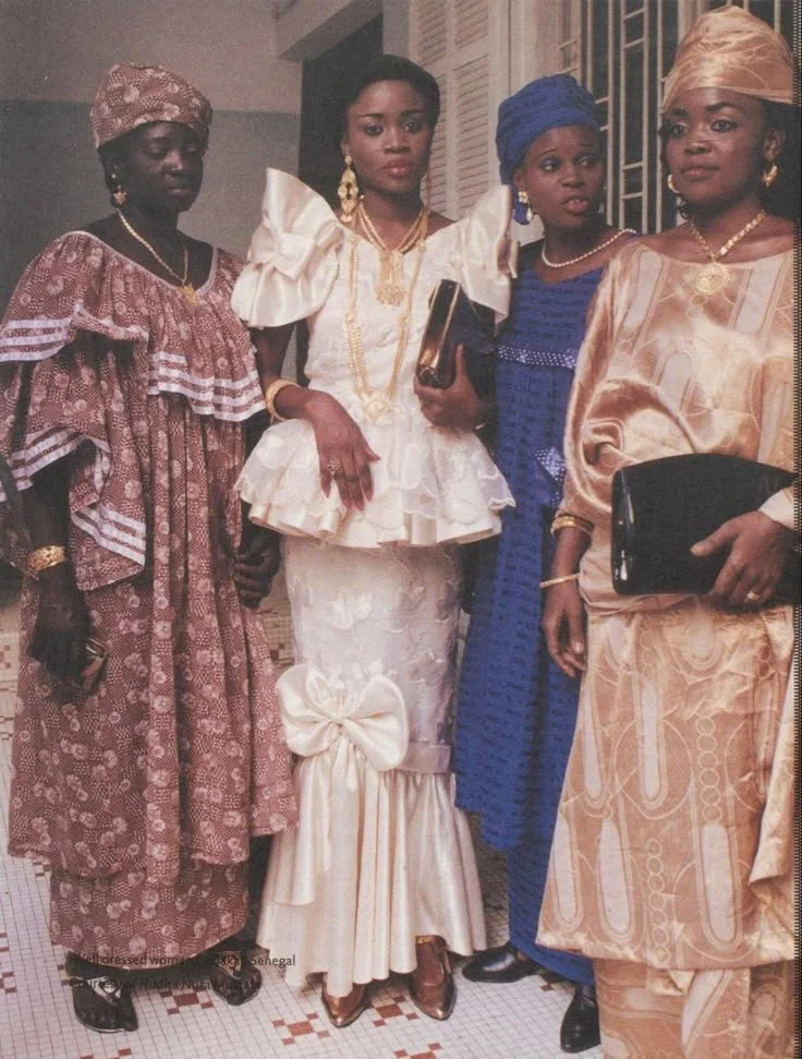 Senegalese women in Dakar wearing Bazin garments and traditional, 1998.