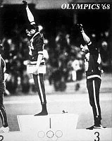 OLYMPIC GAMES, 1968.
American runners Tommie Smith (left) and John Carlos (right) giving the Black Power salute during the medal ceremonies at the Summer Olympic Games in Mexico City. Photograph, 1968