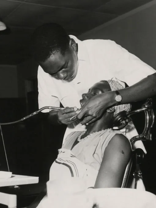 A dental assistant attends a patient at the Dental Unit, Princess Margaret Hospital, Dar es Salaam (1960) 
image credits: National Archive 