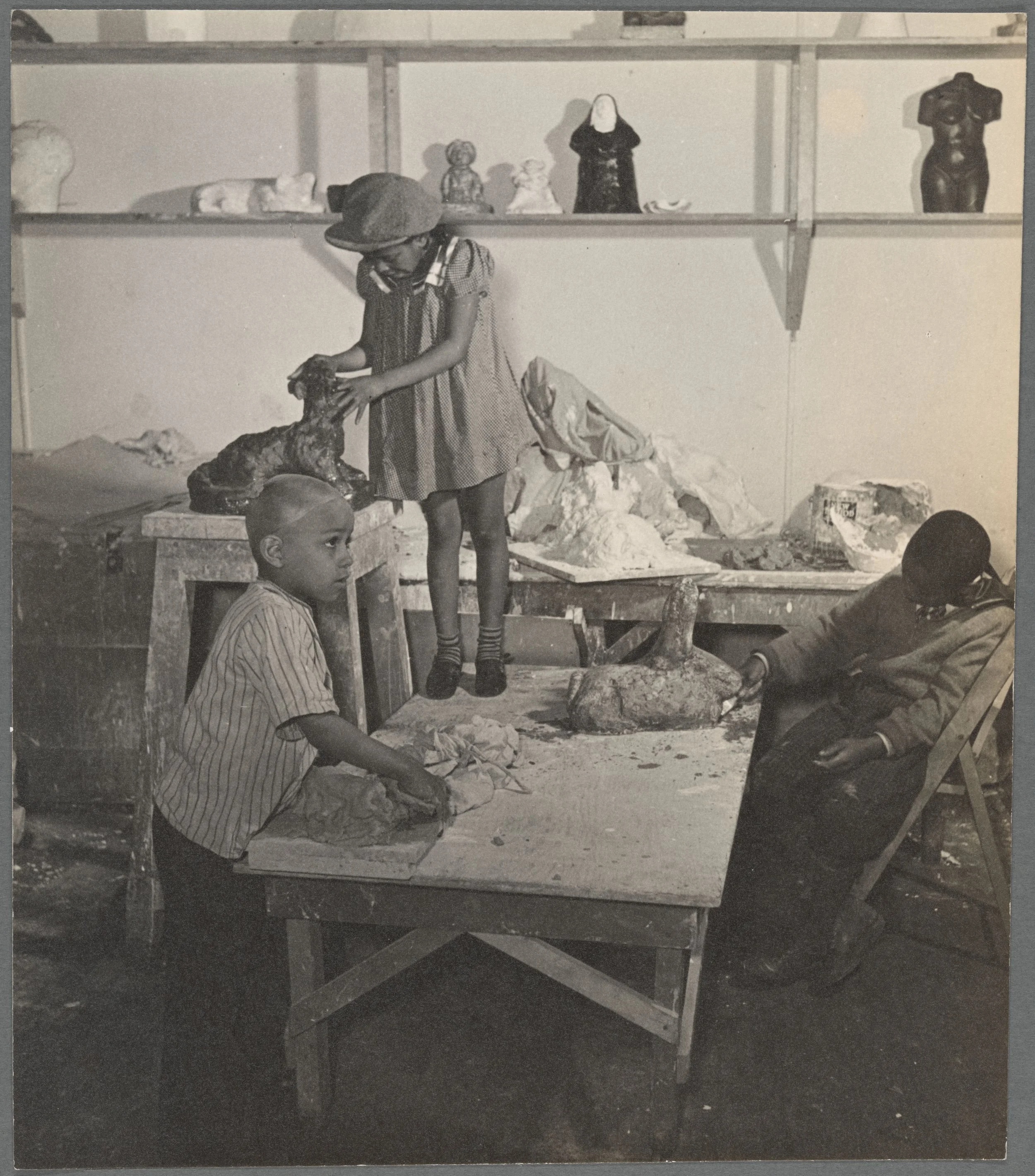 Students in Augusta Savage's sculpture class at the Harlem Community Center in 1939 — source: The Miriam and Ira D. Wallach Division of Art, Prints and Photographs: Photography Collection, The New York Public Library. "Harlem Community Art Center: st