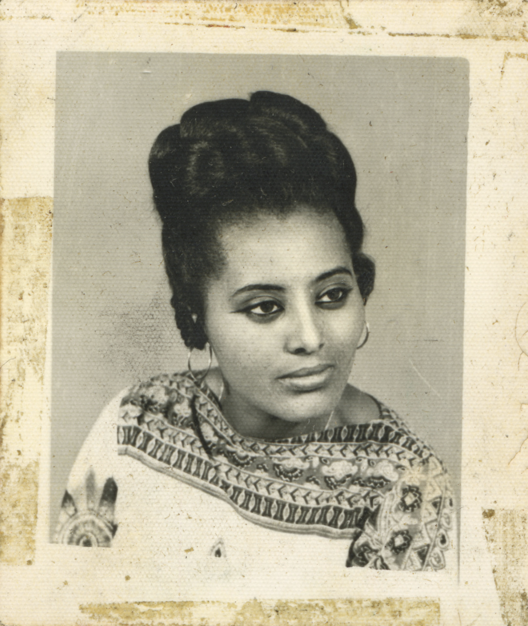 Young woman from Addis Ababa, Ethiopia with a high sculpted, voluminous updo.