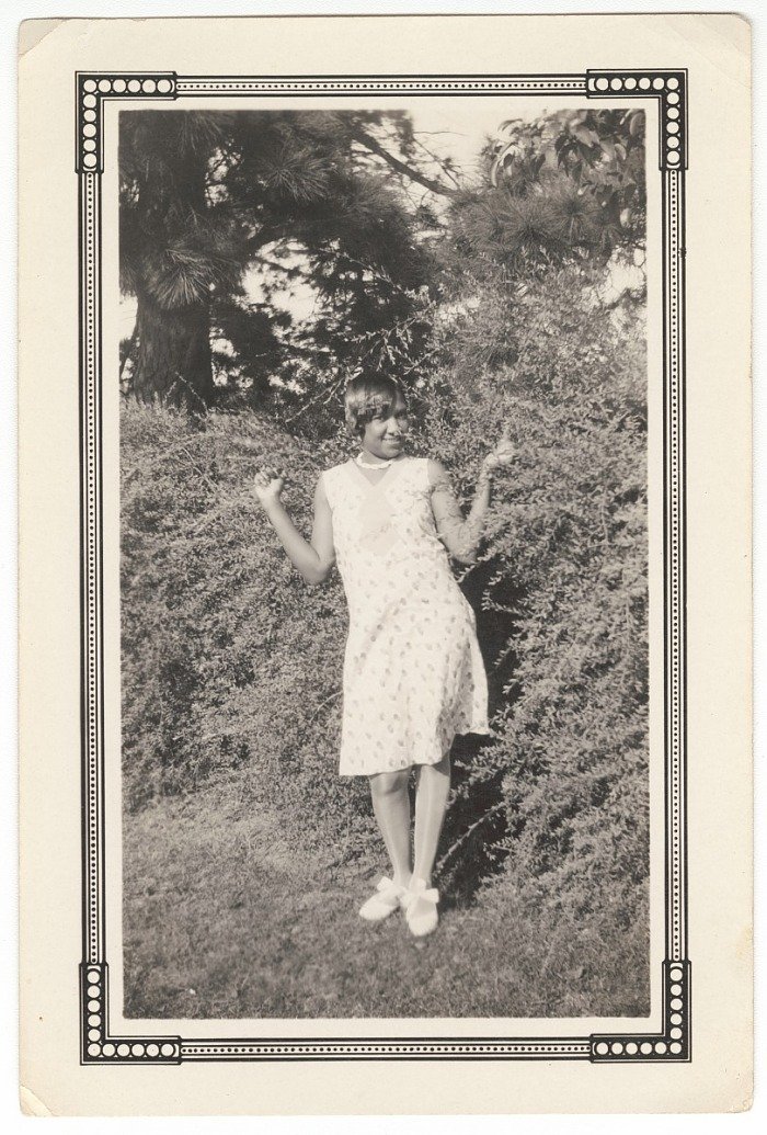 The Princetta R. Newman Collection of Family Photographs, Tulsa, Oklahoma. (n.d.). Photographic print of a woman posing in front of bushes, Jackson, Eunice, American, 1903 - 2004. (n.d.). Collection of the Smithsonian National Museum of African Ameri