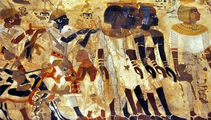 Nubians in worship, relief depicting Nubian figures in devotional scenes within ancient Egyptian temple art. Source: Nubia and the Noba People, Black History Month UK.