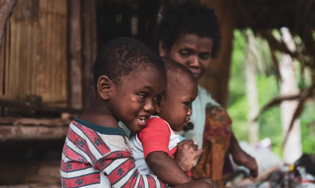 Portait of children and An, a Maniq tribe leader — Image via TravelFeed by worldcapture