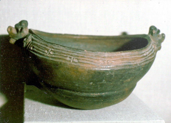Boat shaped bowl with effigy handles