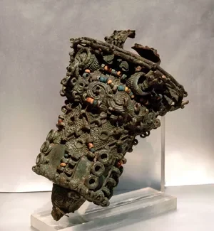 Leaded bronze ceremonial object, thought to have been the head of a staff, decorated with colored beads of glass and stone, 9th century, from Igbo Ukwu, Nigeria.