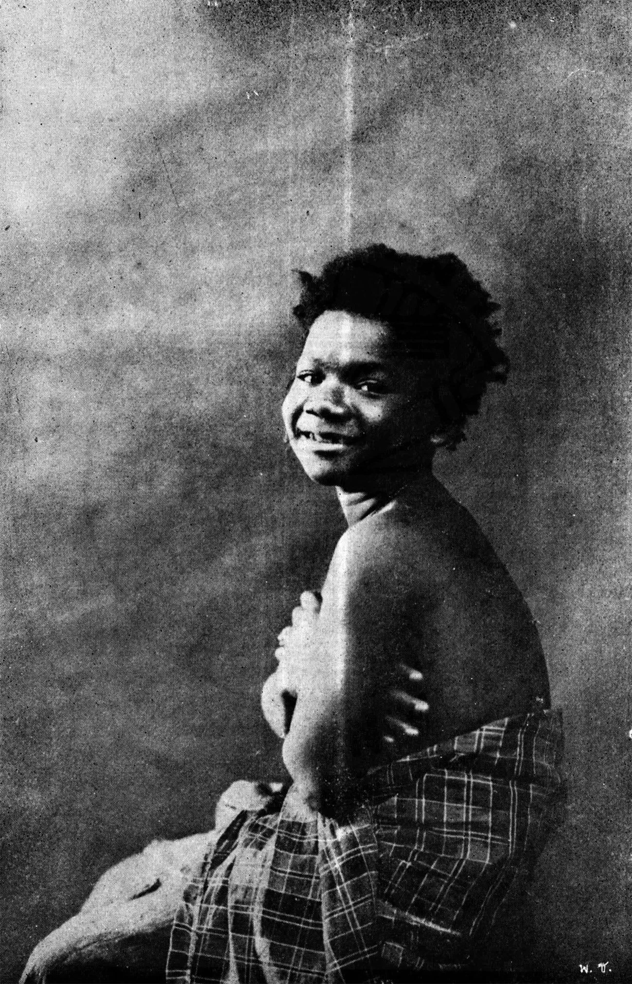 A portrait of Khanang Kirataka, an Maniq royal page boy at the service of King Chulalongkorn of Siam in 1906 — Image via Wikipedia 