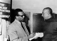STOKELY CARMICHAEL
(1941-1998). American (Trinidadian born) civil rights activist. Carmichael (right) being interviewed by Stanley S. Scott at the Student Non-Violent Coordinating Committee (SNCC) headquarters in New York. Photograph, 1966