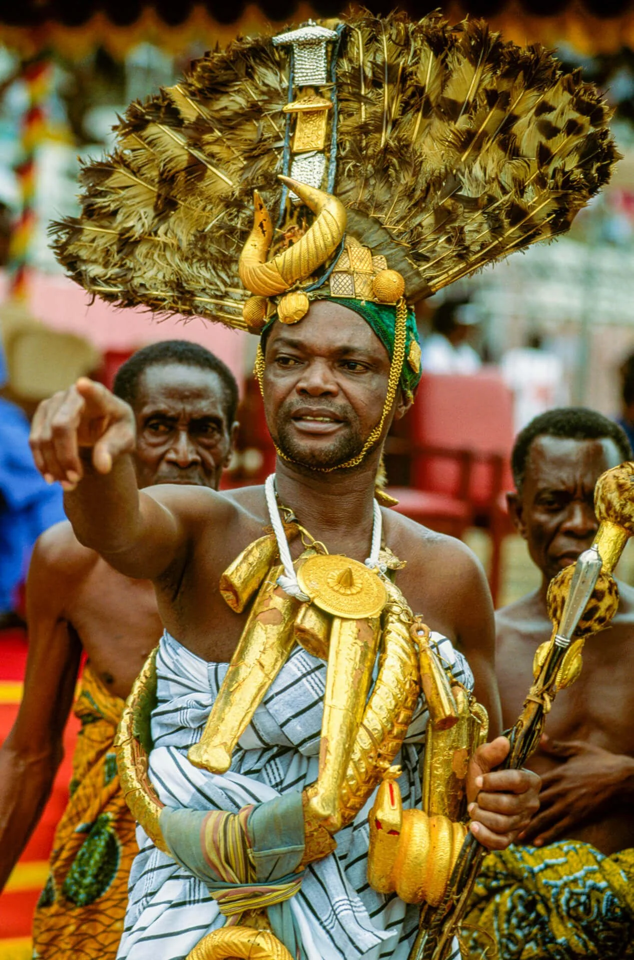 Ashanti Chief Sword Bearer, Ghana. Unknown photographer. (n.d.). Ashanti Chief Sword Bearer, Ghana [Photograph]. Africa Online Museum. This image portrays an Ashanti Chief Sword Bearer, a ceremonial official entrusted with safeguarding the authority 