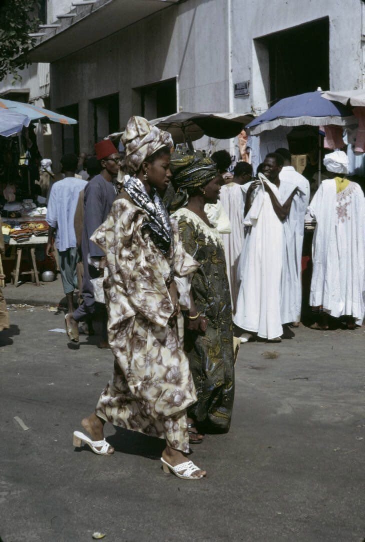 Senegalese woman wearing a boubou and headwrap, photographed by Harrison Forman, 1961. 
