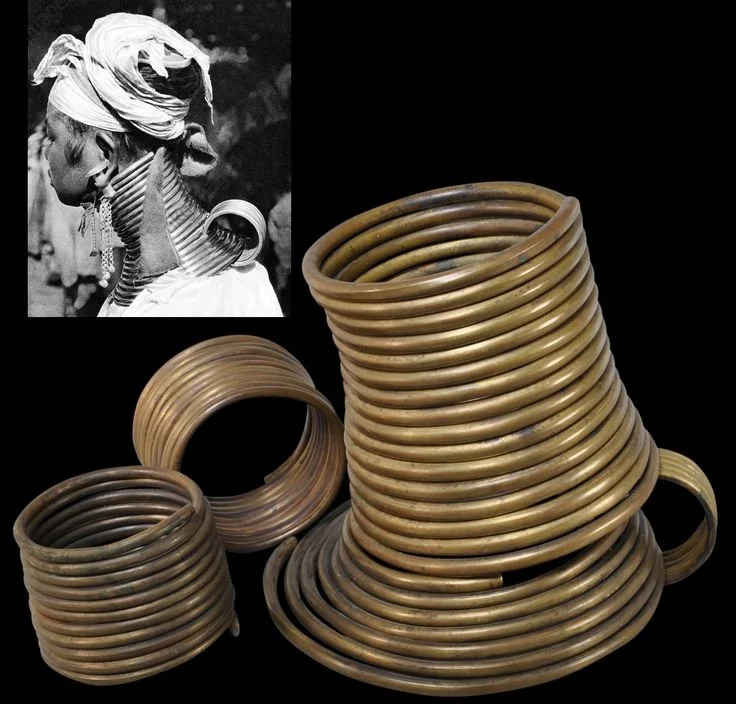 Paduang or Kayan Lahwi Woman's Brass Neck Rings & Anklets. Within their culture, a long-extended neck resembles beauty.