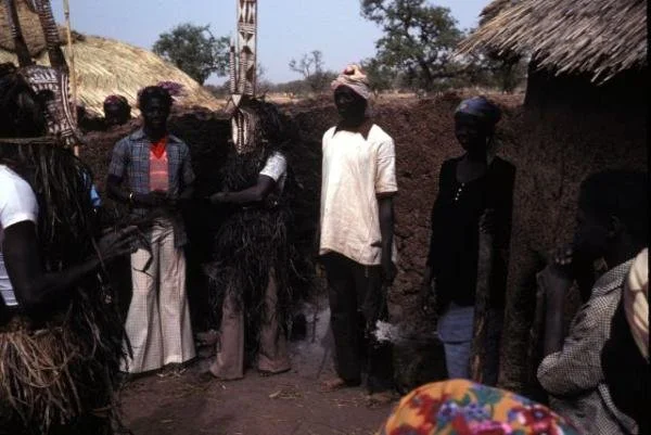 Mossi funeral north of Yako, 1977, Yatenga style karanse. The masks perform in front of the dead man's house.  via https://www.randafricanart.com/Mossi_mask_2.html
