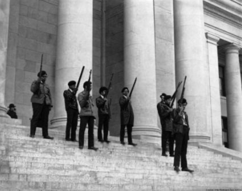Photograph of Seattle Black Panther Party members standing armed on the steps of the Washington State Capitol in Olympia during a protest. Photographer unknown, February 28, 1969. Washington State Archives Collection, Seattle Civil Rights & History P
