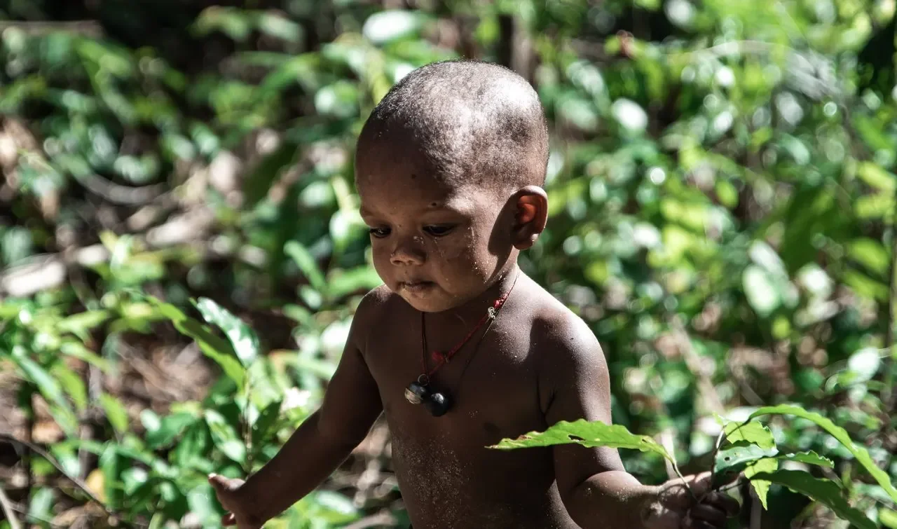 A Maniq toddler — Image via TravelFeed by worldcapture