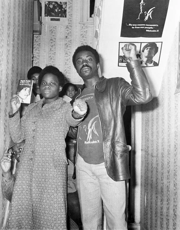 Movement members at the Black Panther headquarters on Shakespeare Road. By Neil Kenlock.