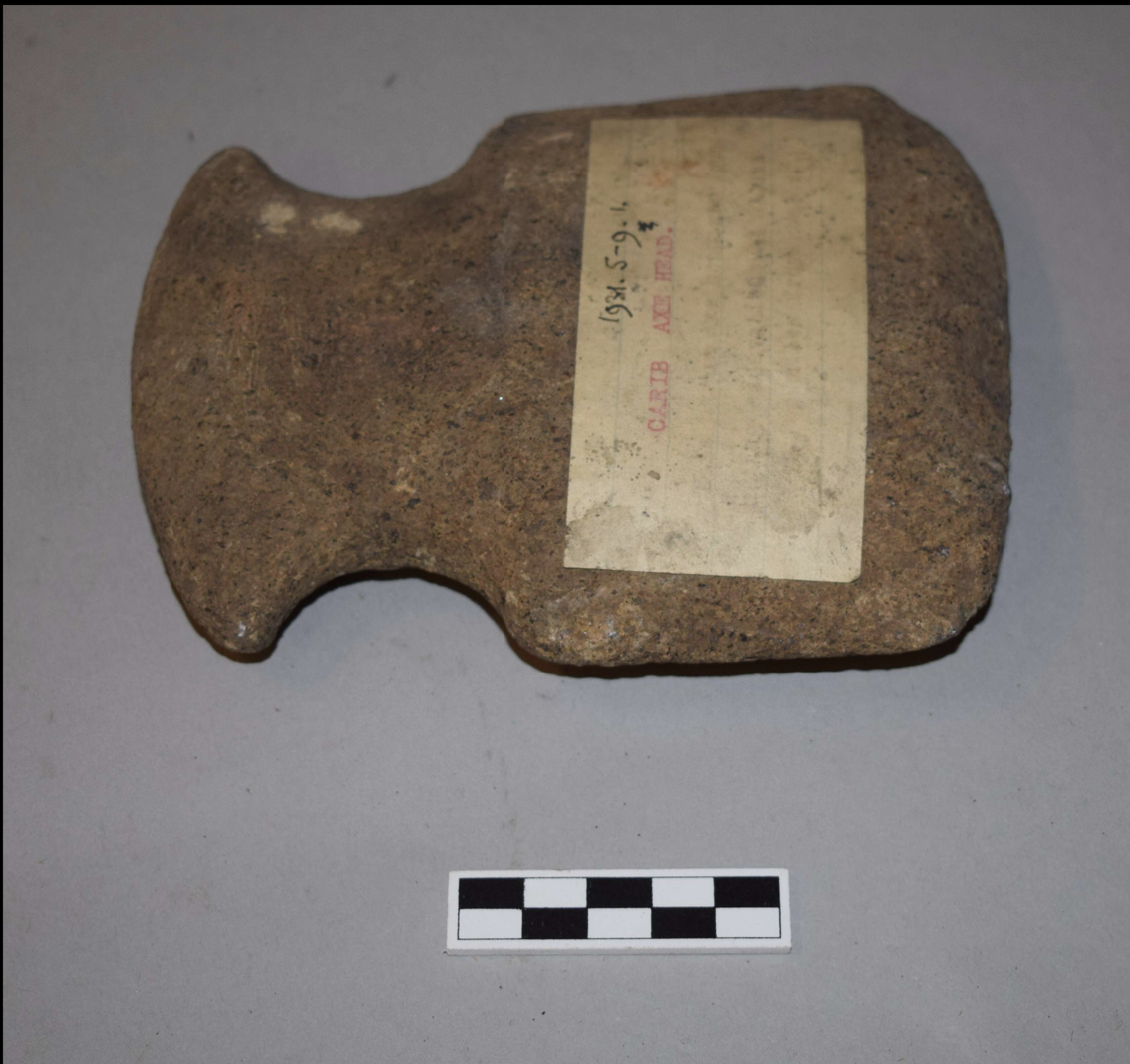 Carib Style Axe. Stone; Length 15 cm × Width 12 cm × Depth 3.20 cm. Caribbean, Americas.
This axe, identified as Carib style, was excavated in the Caribbean and reflects Indigenous stone tool traditions of the region. Carved and shaped from stone, th