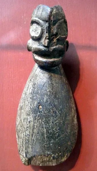 Carved Spoon with Anthropomorphic Handle. Taíno culture; Jamaica, Caribbean. Wood, carved. This carved wooden spoon features a stylized human face forming the handle, merging utilitarian design with spiritual symbolism. The exaggerated facial feature