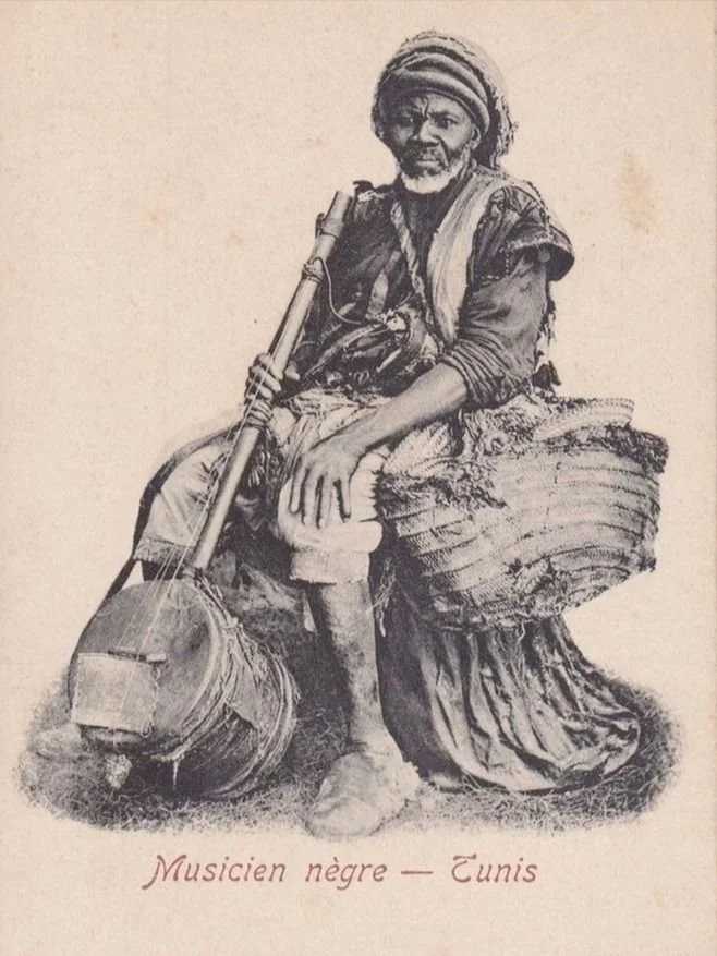 Musician in Tunis with a guembri.
