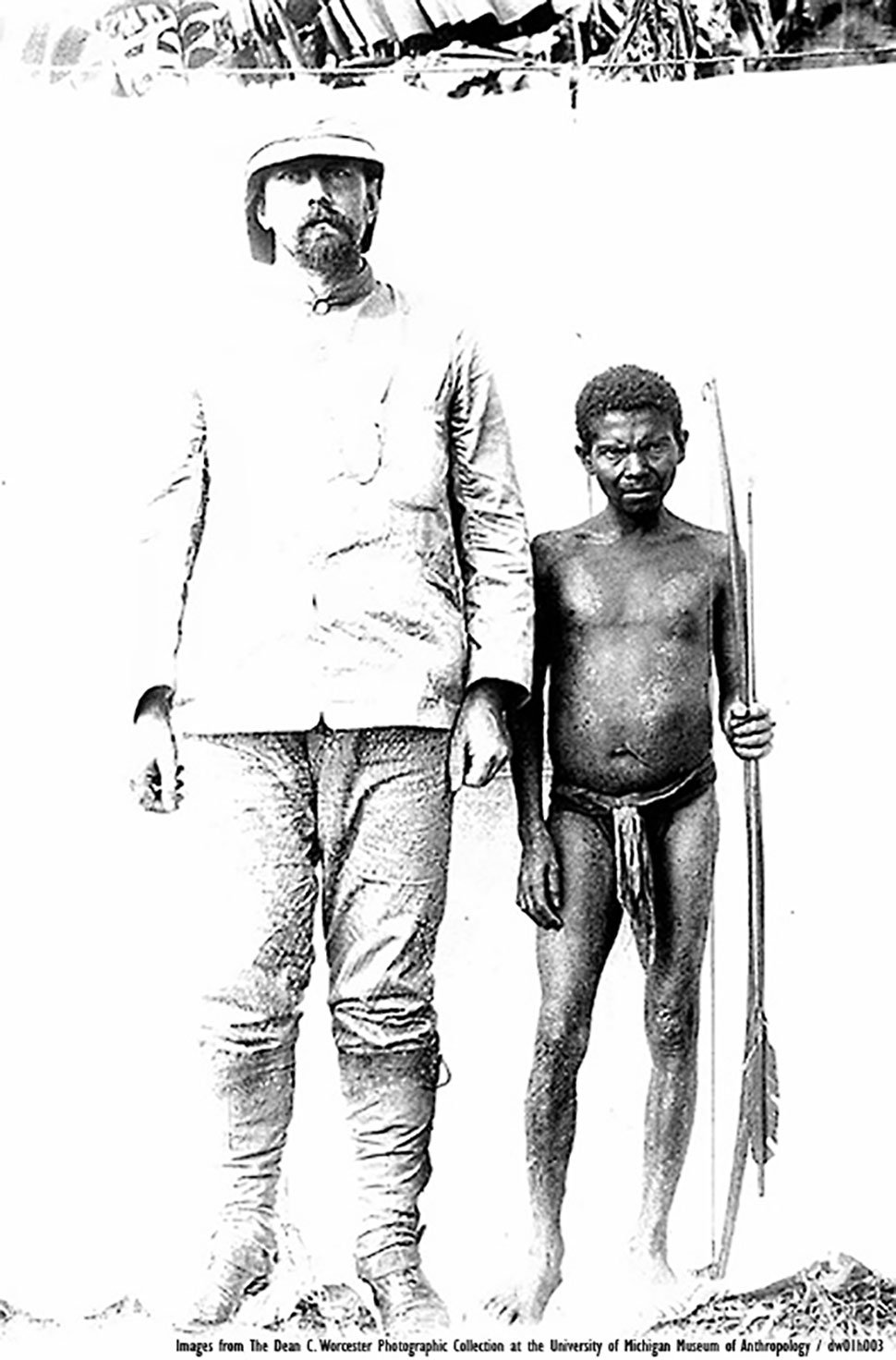 THE LONG AND THE SHORT OF IT. Dean C. Worcester, secretary of interior of the American-administered Philippines, liked being photographed with tiny Negritos for size comparison.
Photo by THE DEAN C. WORCESTER PHOTOGRAPHIC COLLECTION.