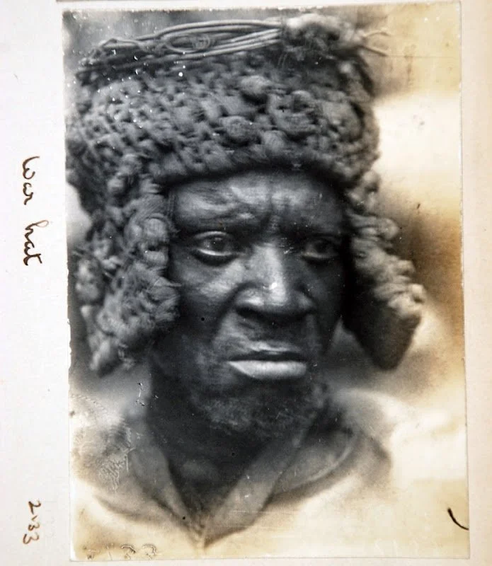 An Igbo elder of Öka (Awka) wearing an okpu agha, or "war hat" as noted here by Northcote Thomas, 1910-11. Northcote Thomas' album, MAA Cambridge.

As a defence against ... weapons the Ibo had devised fibre 'crash' helmets or okpu agha. Those ... are