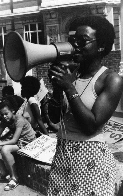 Olive Morris in about 1978 at a rally outside the Brixton Tate Library, where she and other protesters accused the Special Patrol Group, an arm of the police department intended to combat public disorder, of targeting the black community. London Bor