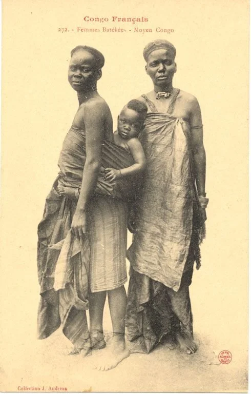 Smithsonian Mother carrying a child, older woman on her side. Congo Français. Photograph by J. Audema. ca.1905 via https://siris-archives.si.edu