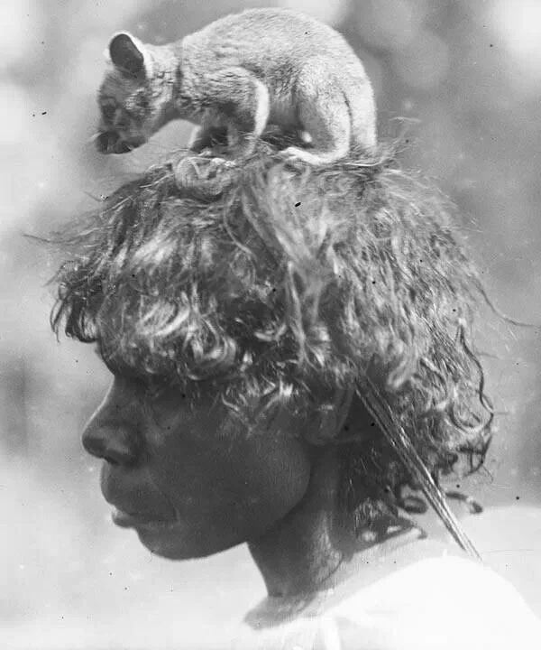 Australia 1902. Woman with possum