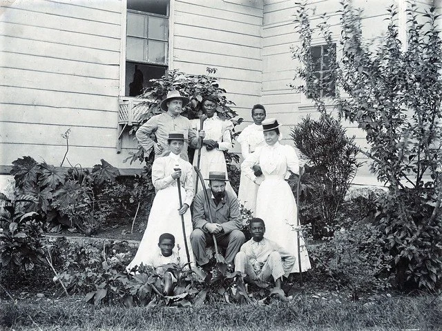 (n.d.). Family In Garden, Jamaica. [Photograph]. The Caribbean Photo Archive. https://www.caribbeanphotoarchive.com