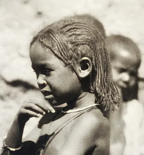 A little girl from Omdurman with fine braids framing her face, (Der Dunkle Erdteil, Berlin 1930)