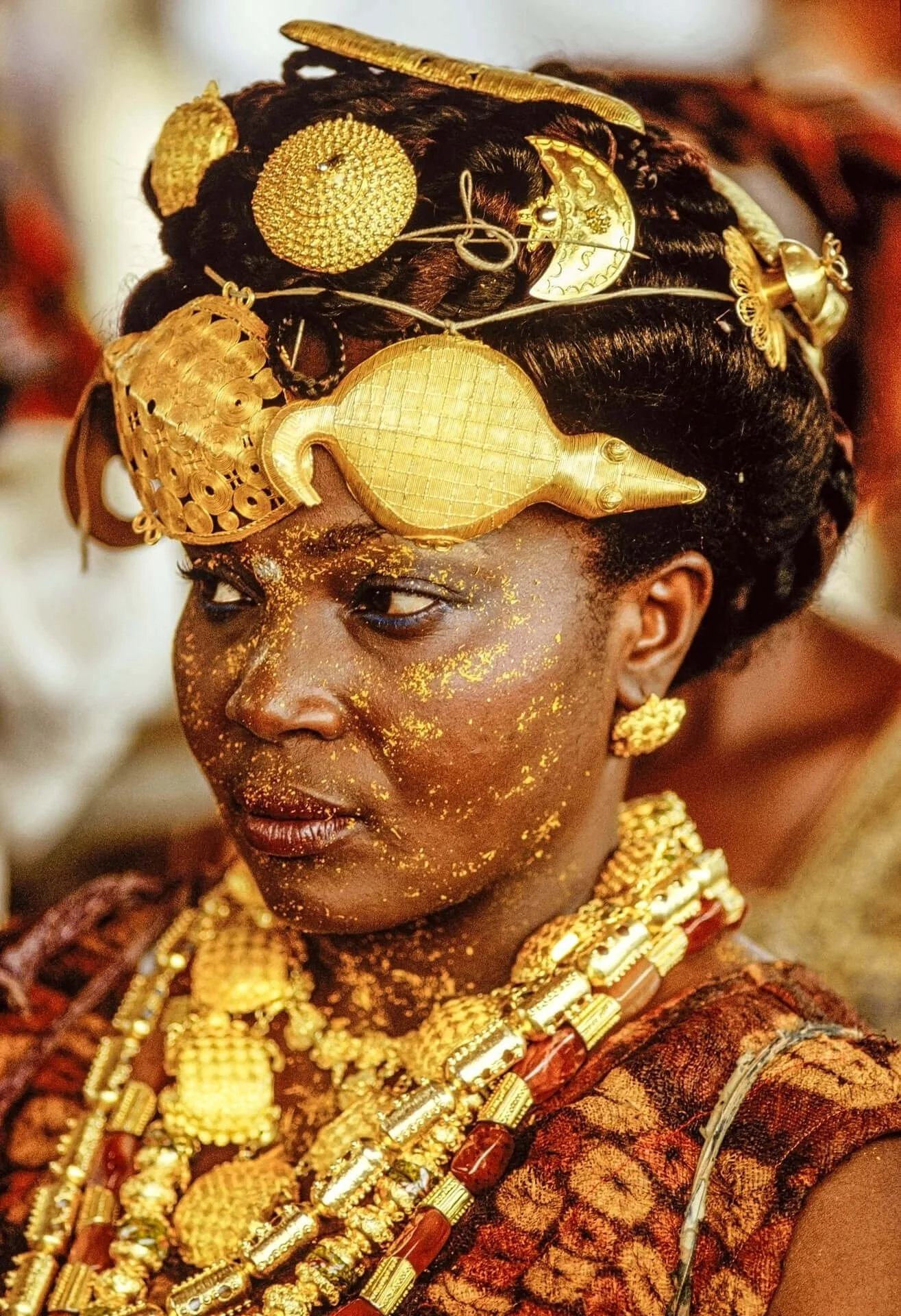 Adioukrou Queen Mother attending the Silver Jubilee, Ivory Coast. This image depicts an Adioukrou Queen Mother adorned in elaborate gold regalia during the Silver Jubilee. Unknown photographer. (n.d.). Adioukrou Queen Mother attending the Silver Jubi