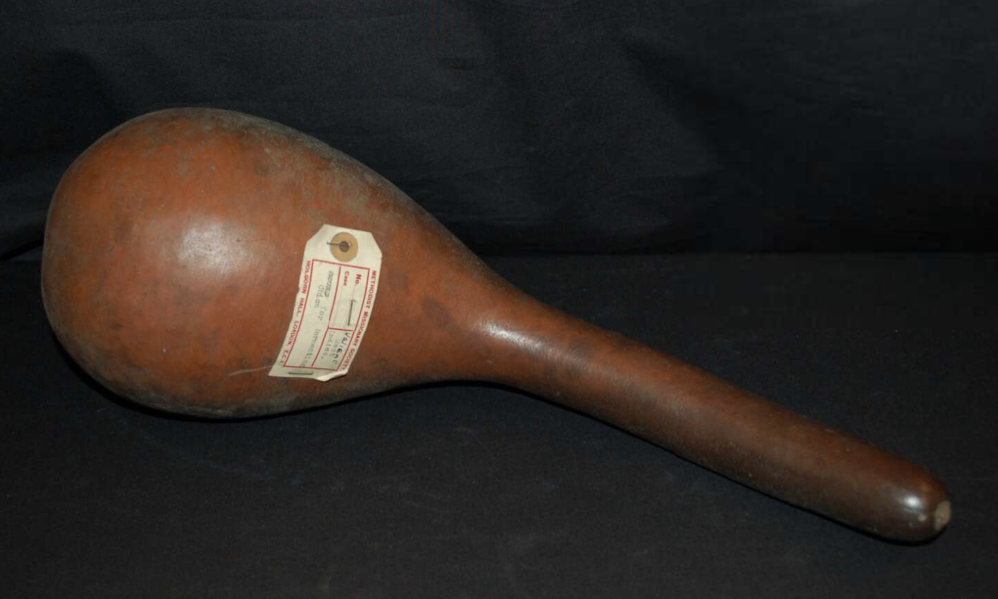 Gourd Vessel for Fermenting Chicha. Gourd; Height 46.50 cm × Diameter 16 cm. Caribbean (West Indies), Americas. This large dried gourd vessel features a globular body with a long neck and a hole bored at the top of the neck. The form and perforation 